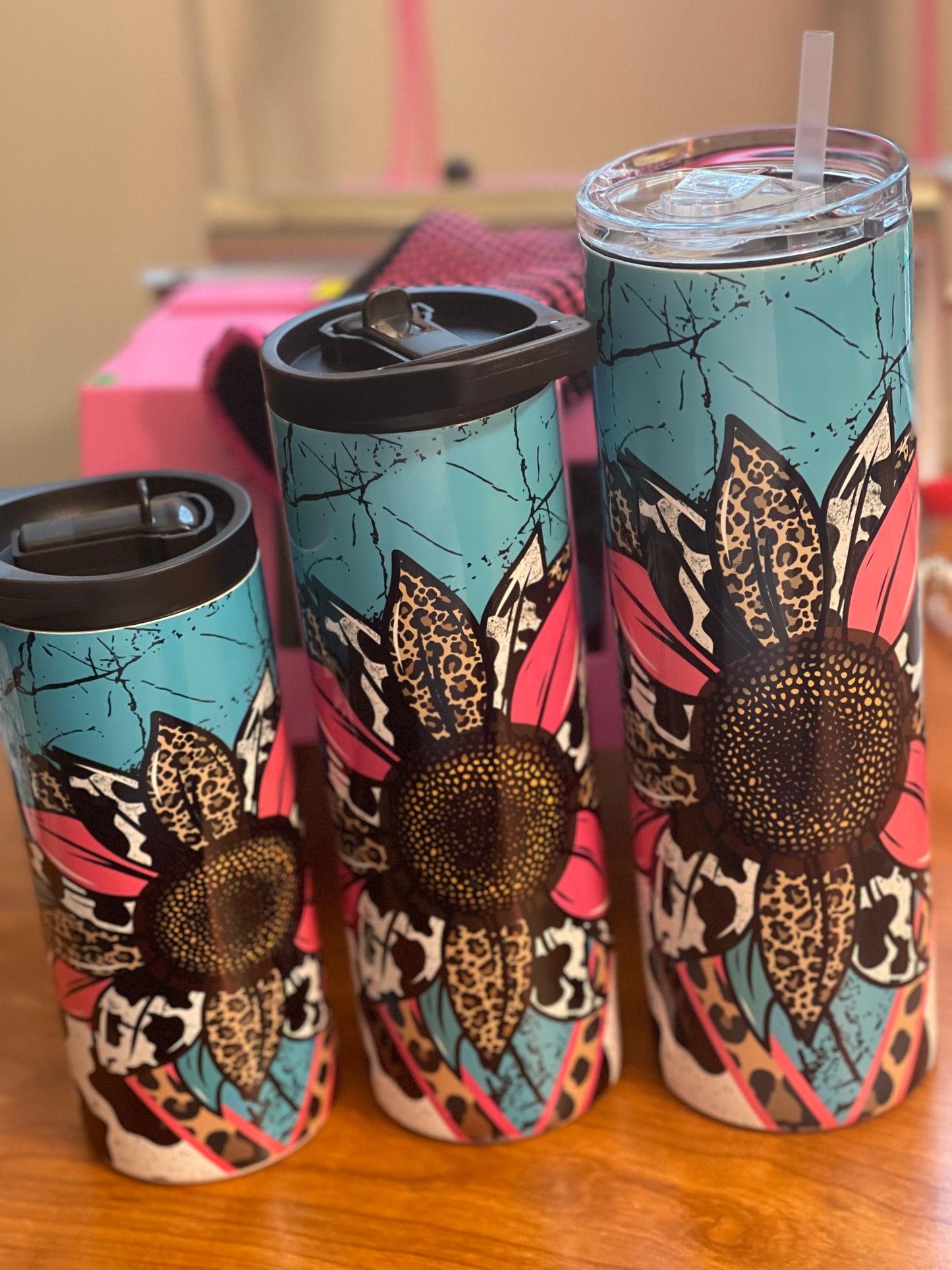 teal, sunflower, leopard, and cow print tumbler